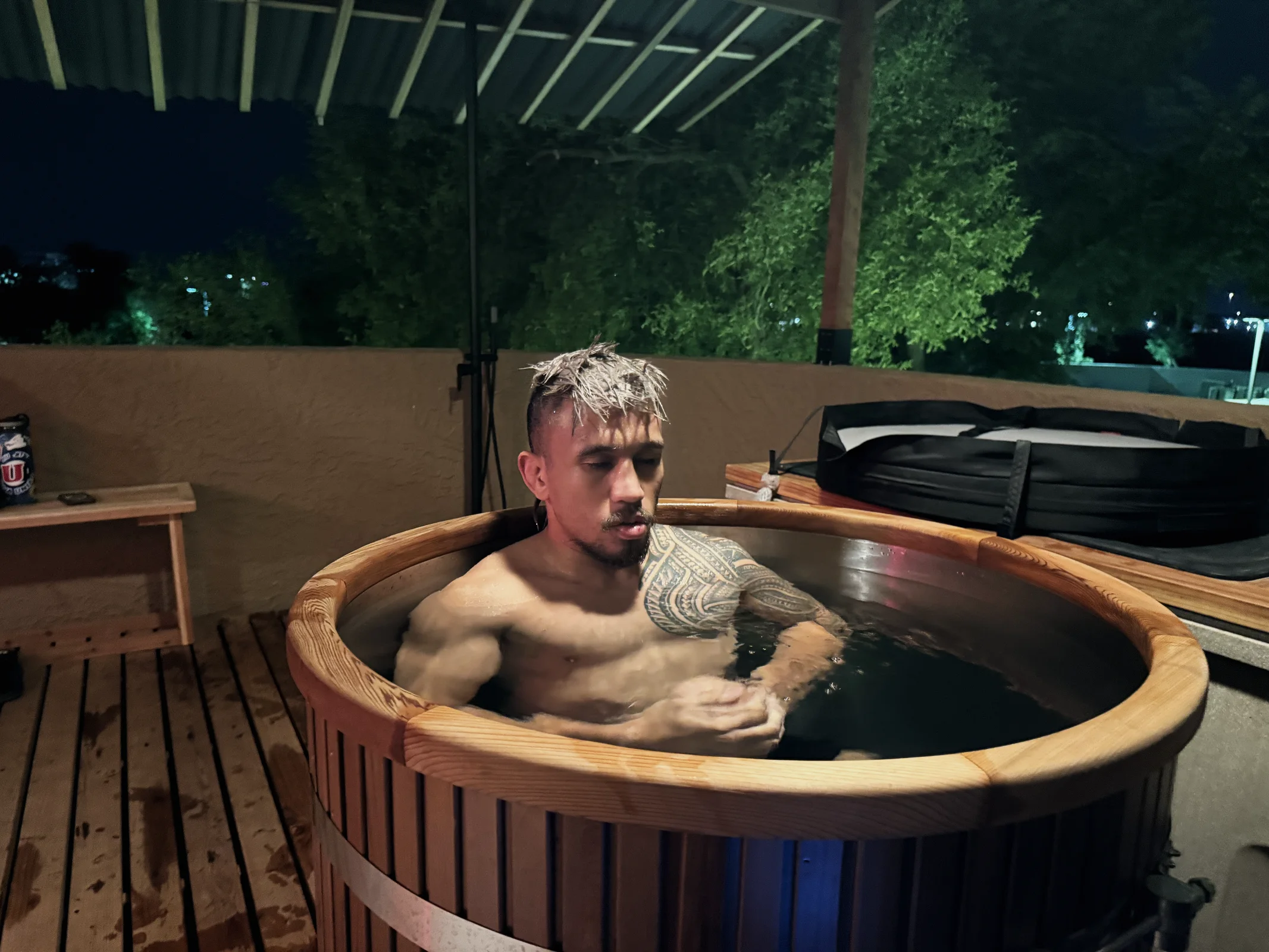 Athlete in a cold plunge barrel at Combat Recovery Center in Tempe
