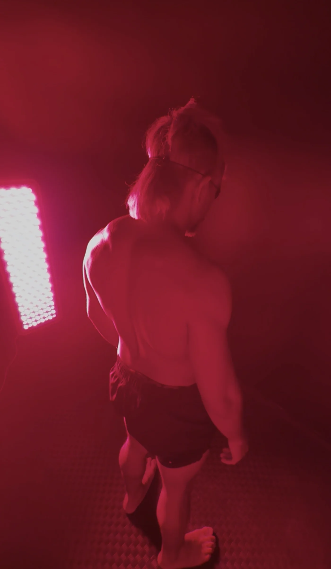 Member in a red light therapy session at Combat Recovery Center